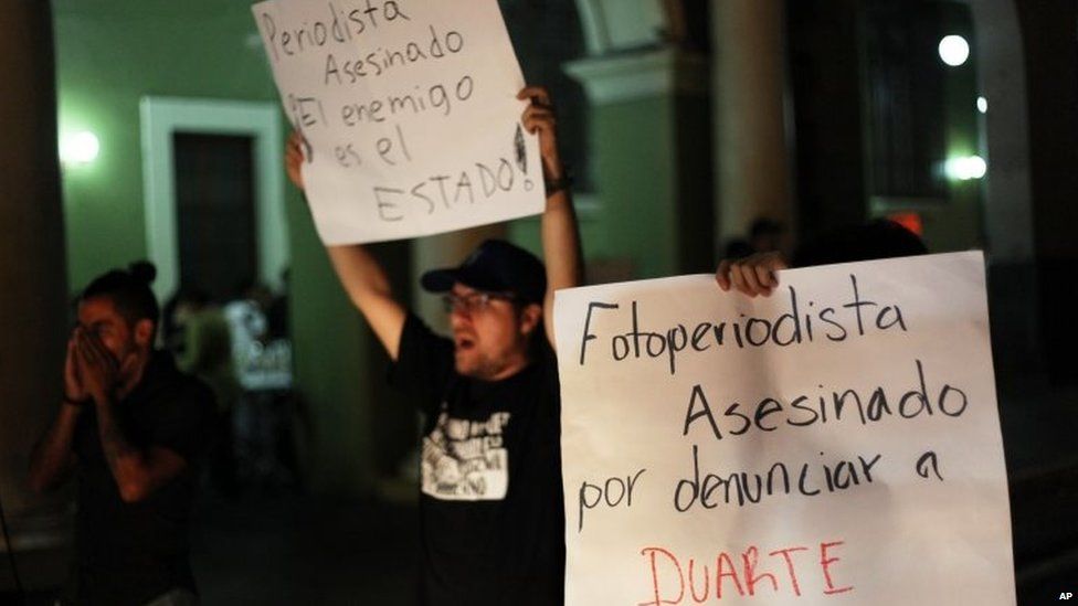 Journalists hold a late night vigil to protest against the latest murder of a fellow journalist in Veracruz on 1 August, 2015