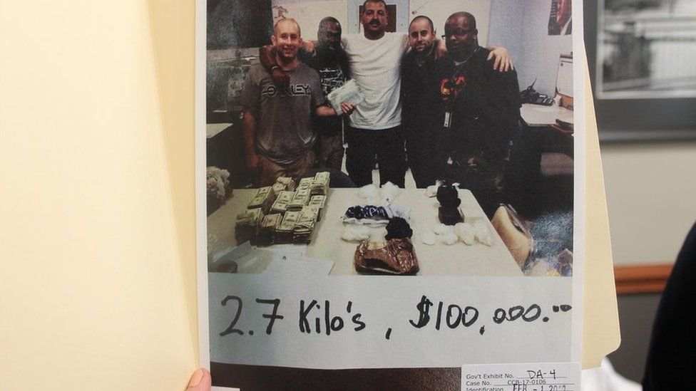 Jenkins and his crew pose with 2.7 kilos of drugs