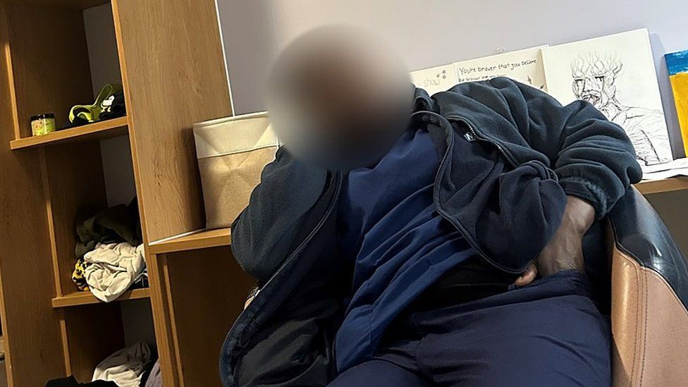 Blurred image of a mental health trust staff member apparently asleep on shift