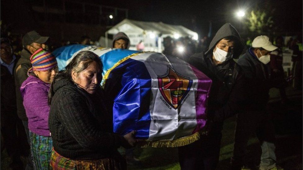 Relatives and friends receive the coffins of the murdered migrants who arrived in Comitancillo, Guatemala, 12 March 2021.
