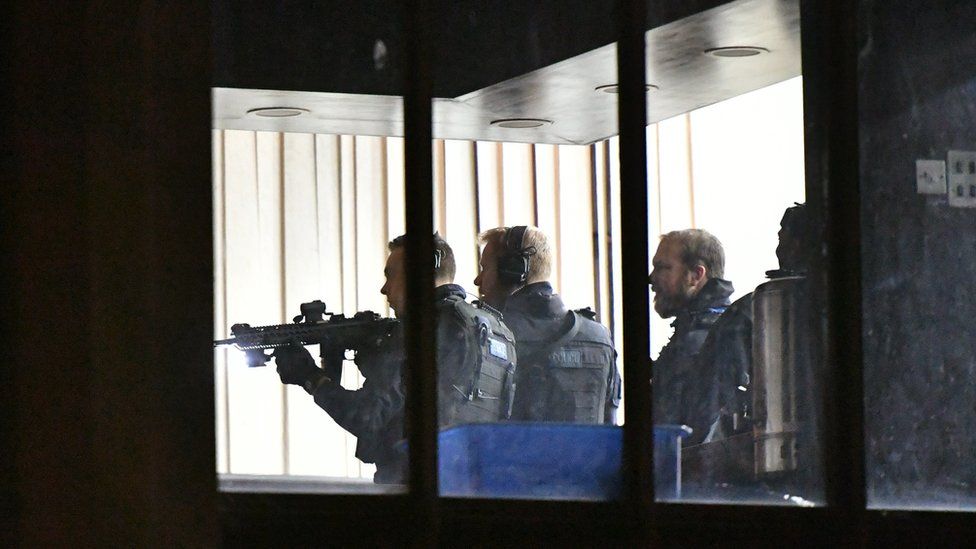 Armed police officers inside London Central Mosque, near Regent's Park