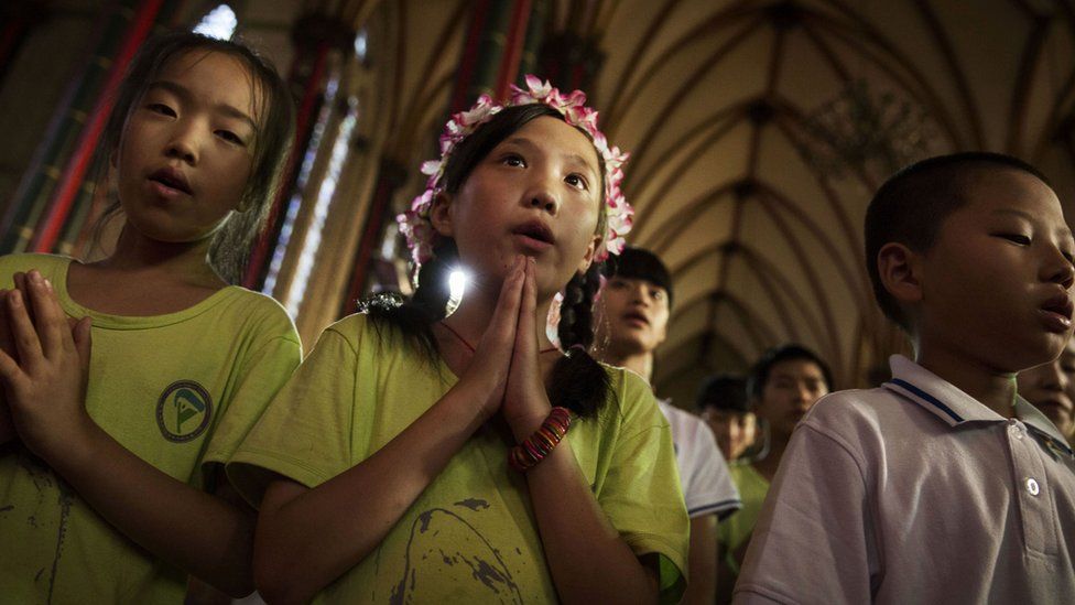 Young Chinese Catholics pray