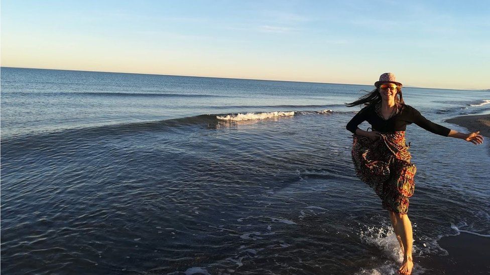 Esther running in the sea