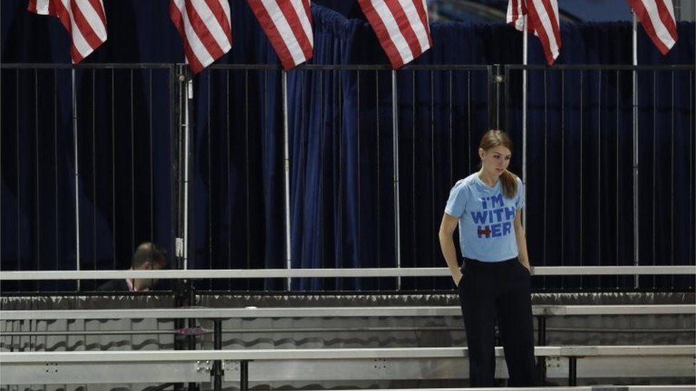 A Clinton supporter stands alone in the bleachers after Democratic presidential nominee Hillary Clinton"s election night rally was cancelled at the Jacob Javits Center in New York, Wednesday, Nov. 9, 2016