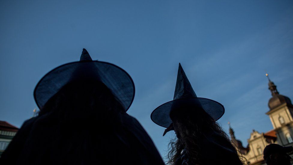 Two women dresses as witches