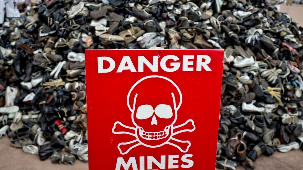 A sign during the annual demonstration by the NGO Handicap International to denounce the use and sale of anti-personnel landmines