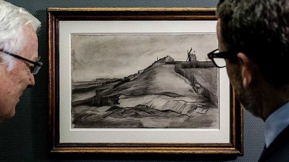 Two men looking at recently discovered Van Gogh sketch