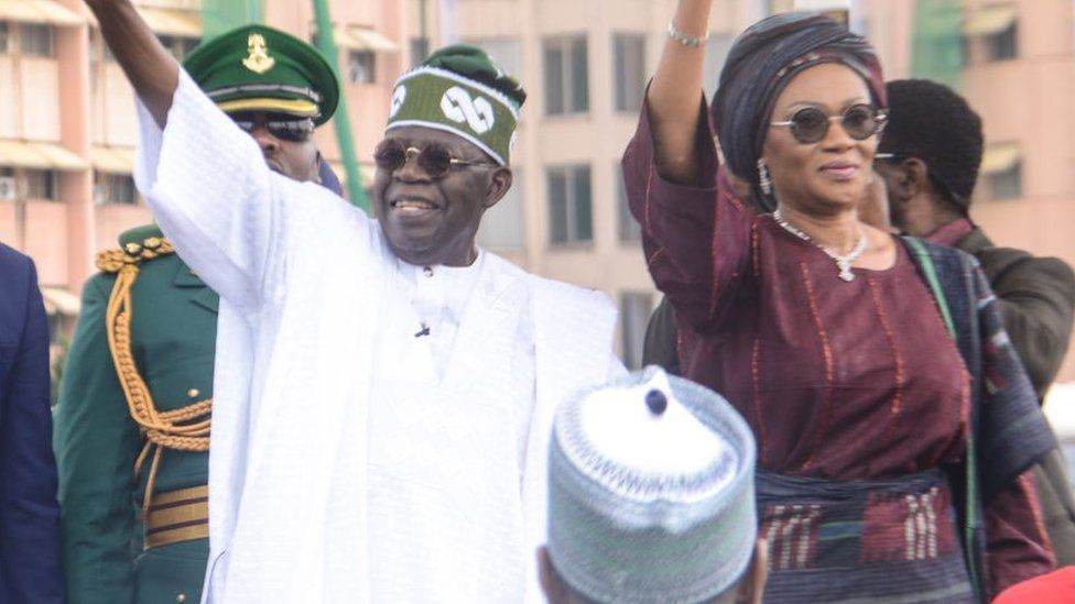 Nigeria's President Bola Tinubu, with his wife Remi Tinubu makes gesture during his inauguration at a swearing-in ceremony at the Eagle Square in Abuja, Nigeria on May 29, 2023