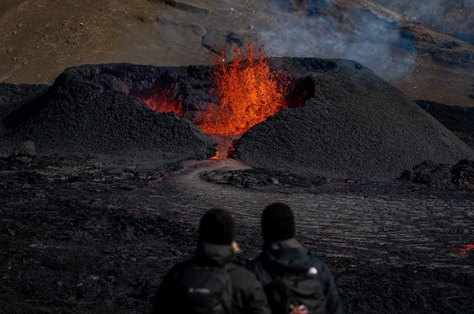 Lava spews from a heart-shaped crater following an eruption from a new fissure of Iceland's Fagradalsfjall volcano on the Reykjanes Peninsula on 15 August 2022