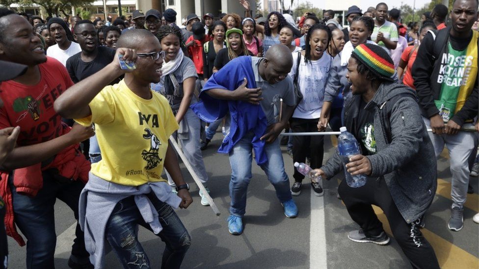 Students sing during their protest for free education in Johannesburg, South Africa, Tuesday, Sept. 20, 2016.