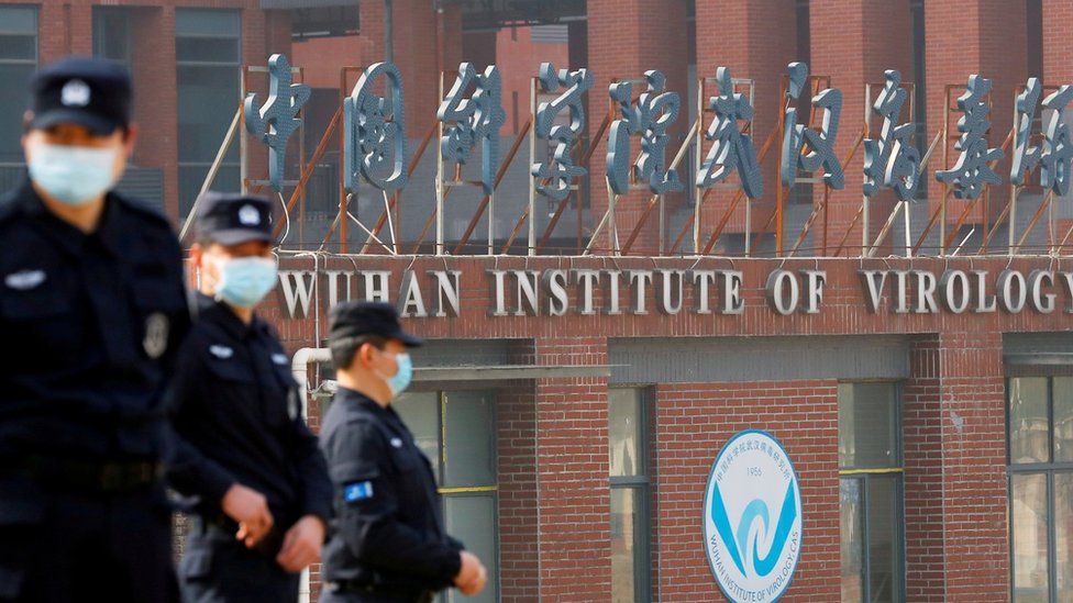 Security personnel keep watch outside the Wuhan Institute of Virology during the visit by the World Health Organization (WHO) team tasked with investigating the origins of the coronavirus disease (COVID-19), in Wuhan, Hubei province, China February 3, 2021.