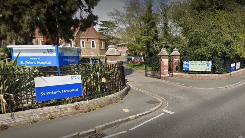 Exterior of main gate St Peter's Hospital Maldon showing the hospital sign with building in the background