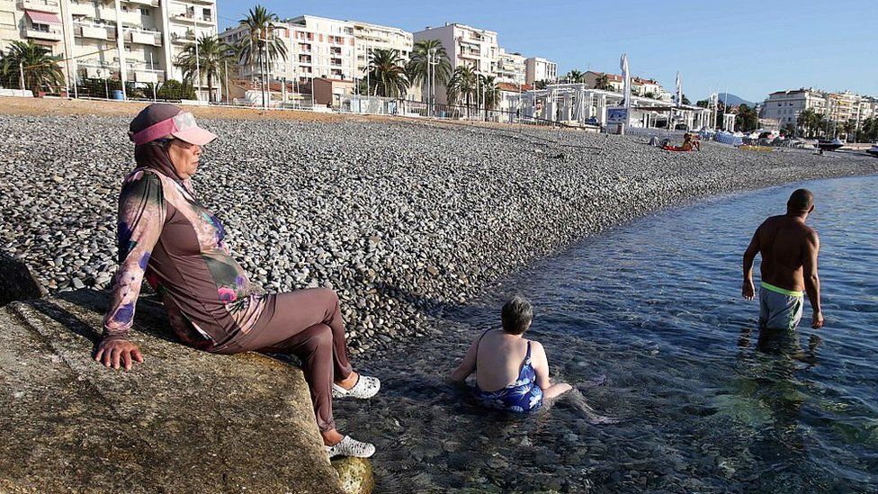 A French woman wears a burkini on a beach in the city of Nice, south-eastern France, on 26 August 2016