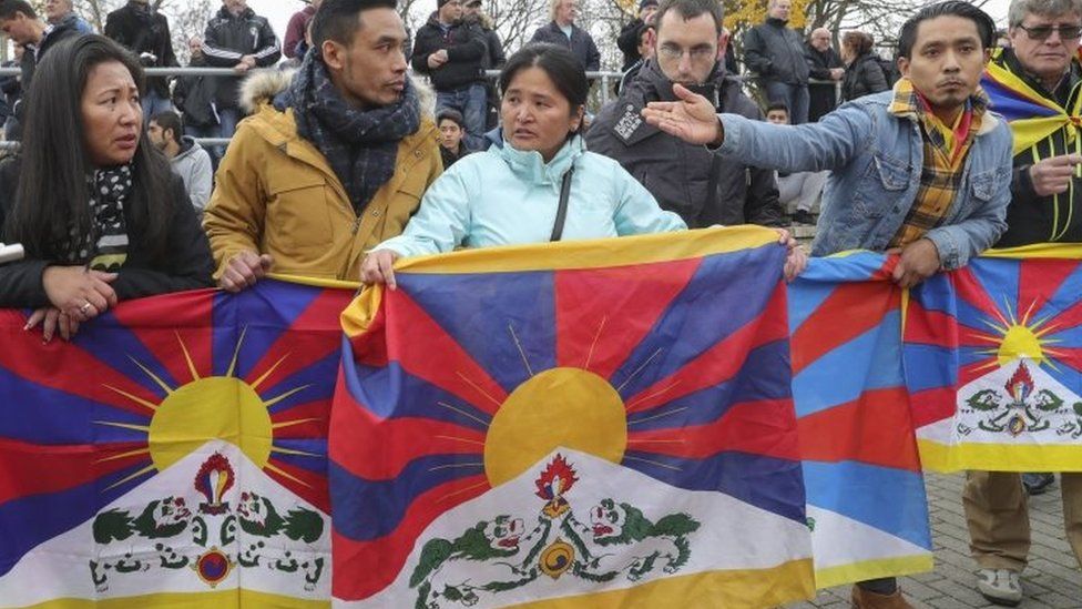 Spectators hold Tibetan flags during a match in Mainz, Germany. Photo: 18 November 2017