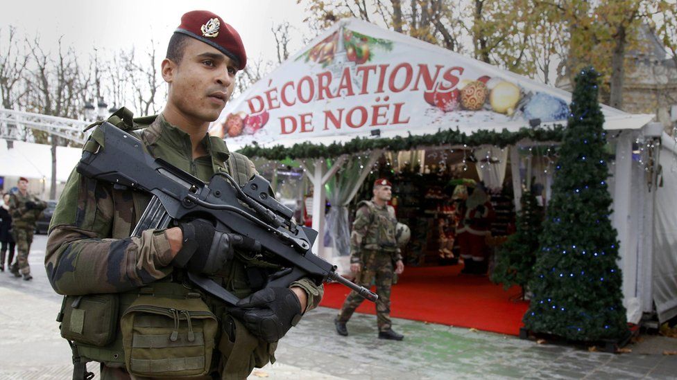 Soldiers patrolling a Christmas market in Paris, 19 Nov 15