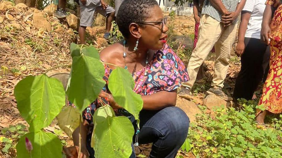 Yvonne Aki-Sawyerr pictured by a seedling - January 2024