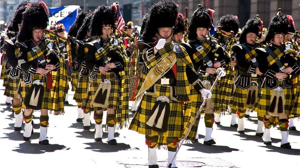 Pipe band marches in Tartan Day parade