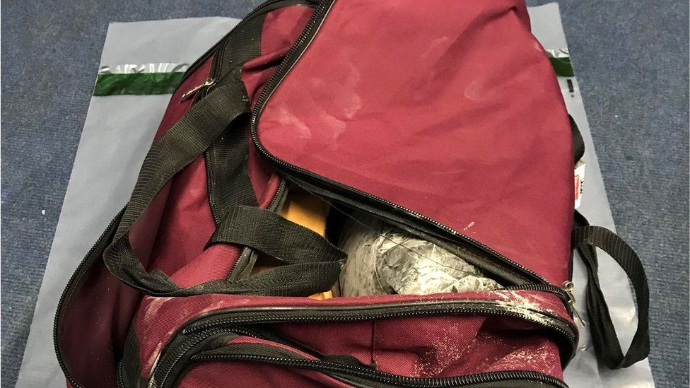 Birmingham Airport heroin smuggler jailed over £1m haul - BBC News