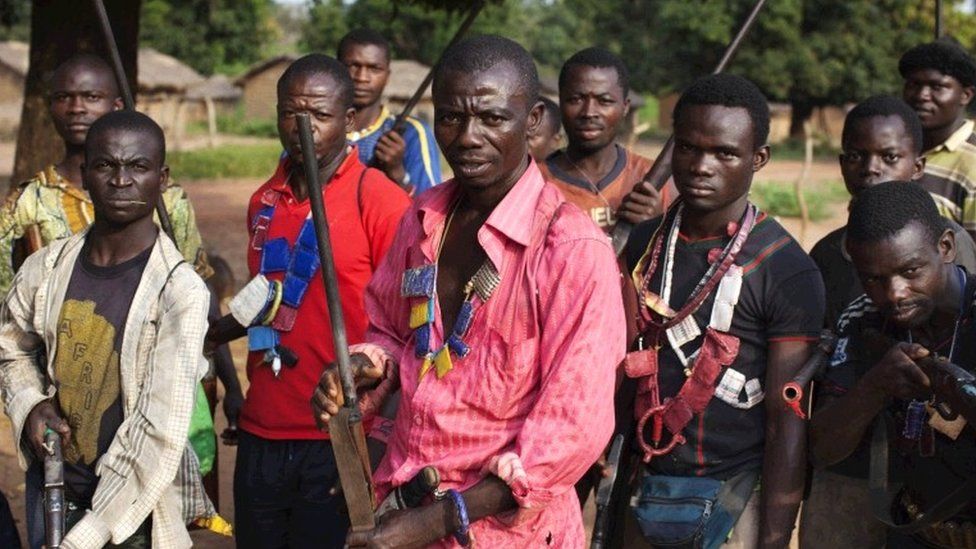 Anti-balaka militia pose for a photograph in Mbakate village, Central African Republic November 25, 2013