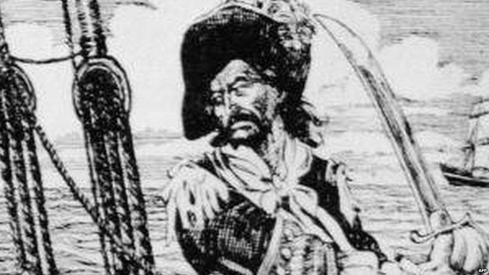 Drawing of Scottish-born American privateer and pirate William 'Captain' Kidd standing on the deck of a ship, brandishing a sword, circa 1690