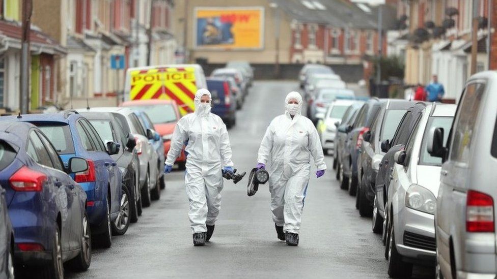 Forensic officers on nearby Graham Street, Swindon