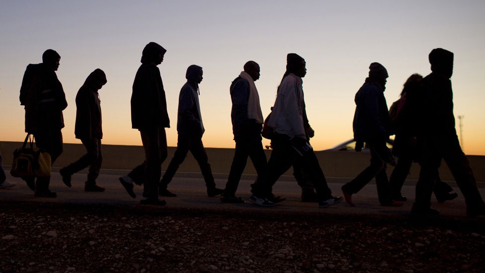 African illegal immigrants take part in a protest march, 2013
