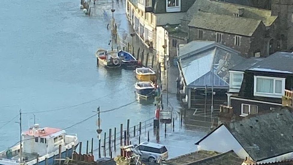 Tide going over car parking spaces at Looe