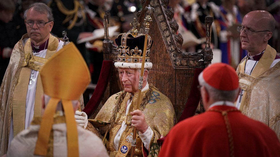 King in coronation chair
