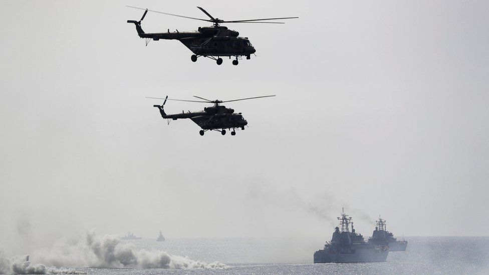 Russian navy ships and helicopters take a part in a landing operation during military drills at the Black Sea coast, Crimea,