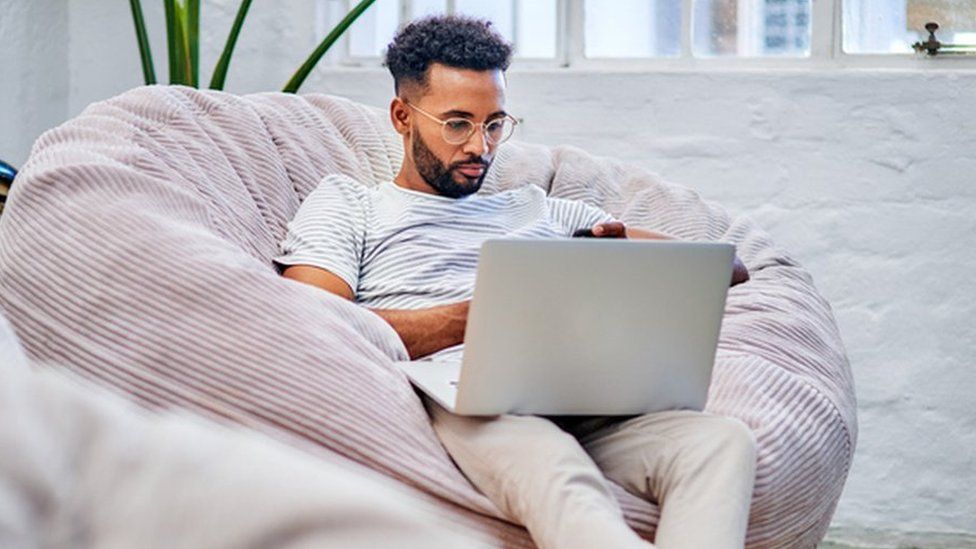 Man on laptop in office
