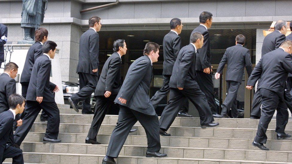 Members of of Japan's largest organised crime syndicate, the Yamaguchi-gumi, outside a court in Osaka