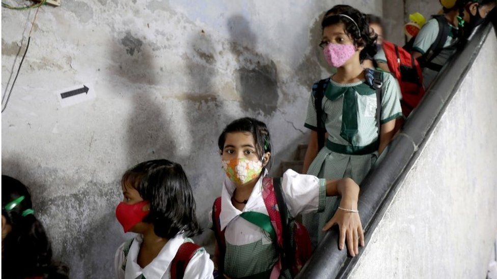 Students wait to receive the Covid-19 vaccine Corbevax manufactured by Biological E. Limited during a vaccination drive at a government school in Kolkata, Eastern India, 21 March 2022