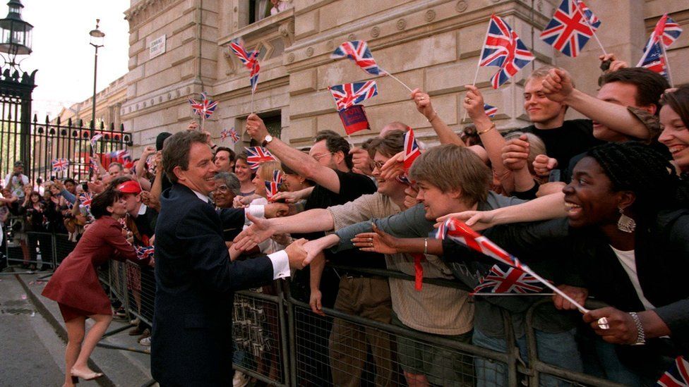 Tony Blair welcomed by supporters as he enters Downing Street in 1997