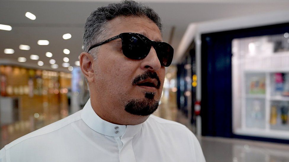 A man wearing sunglasses, who did not give his name, speaks to the BBC in a shopping mall in Jeddah