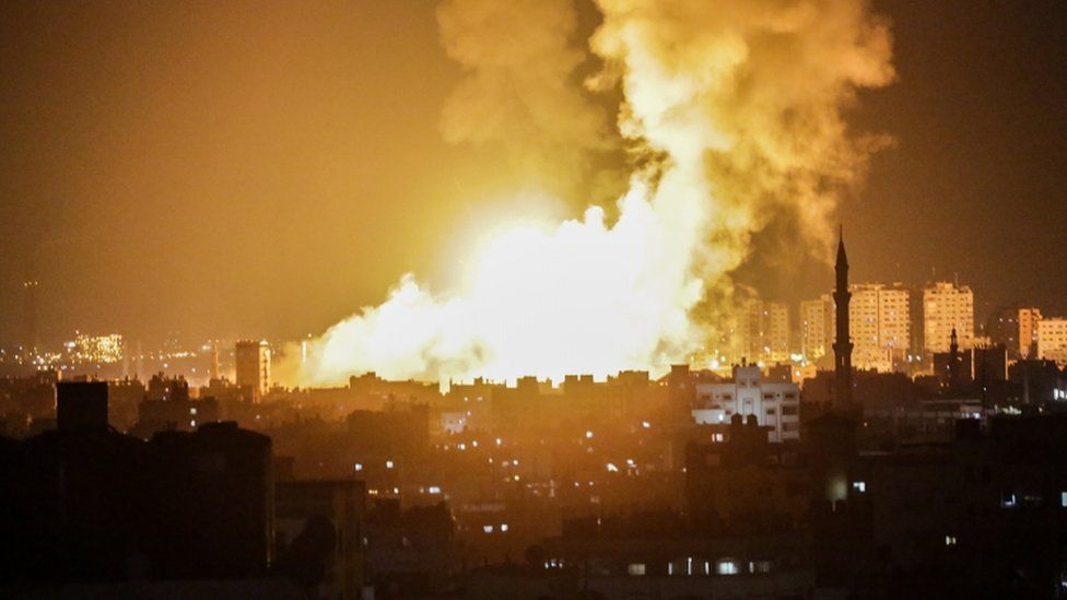 Large plumes of fire and smoke are pictured in Gaza city