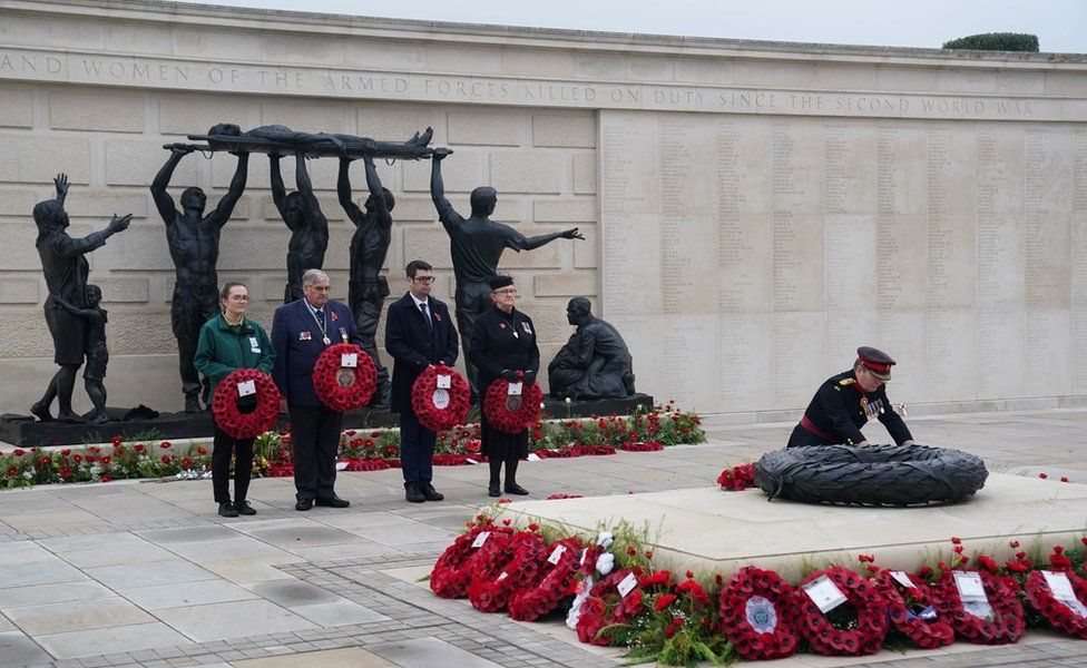 Members of staff from the National Memorial Arboretum as well as members of the military lay wreaths after the Remembrance Sunday service there