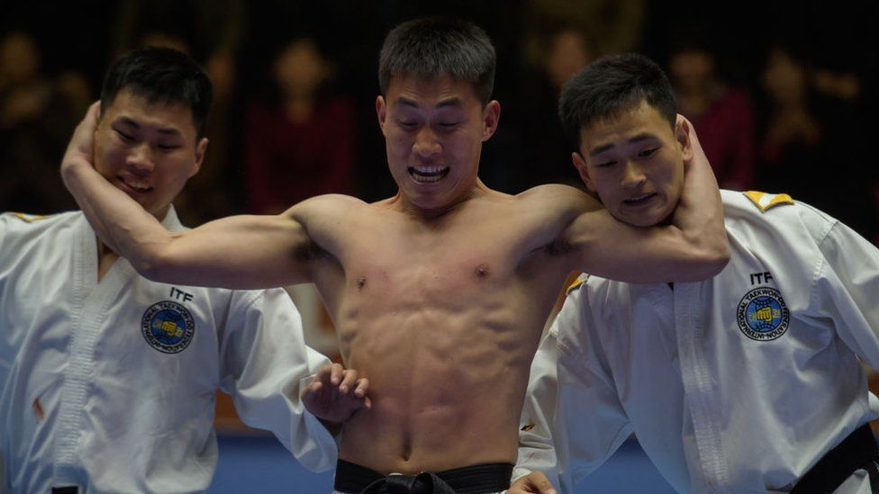 Participants perform a taekwondo demonstration as part of the annual Mangyongdae Prize National Martial Art Championship at the 'Taekwon-Do Hall' in Pyongyang on April 9, 2019.