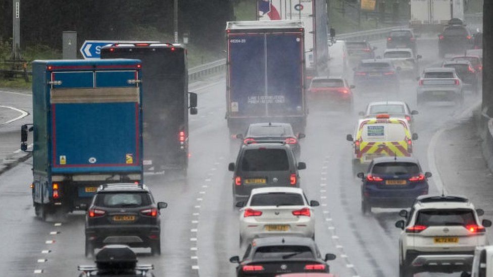 Afternoon rush hour and bank holiday traffic begins to build up on M6 motorway through Cheshire on Thursday