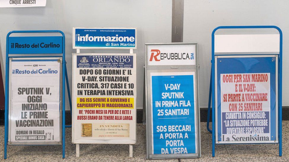News stands about vaccination day in San Marino with the Russian vaccine Sputnik, 25 February, 2021