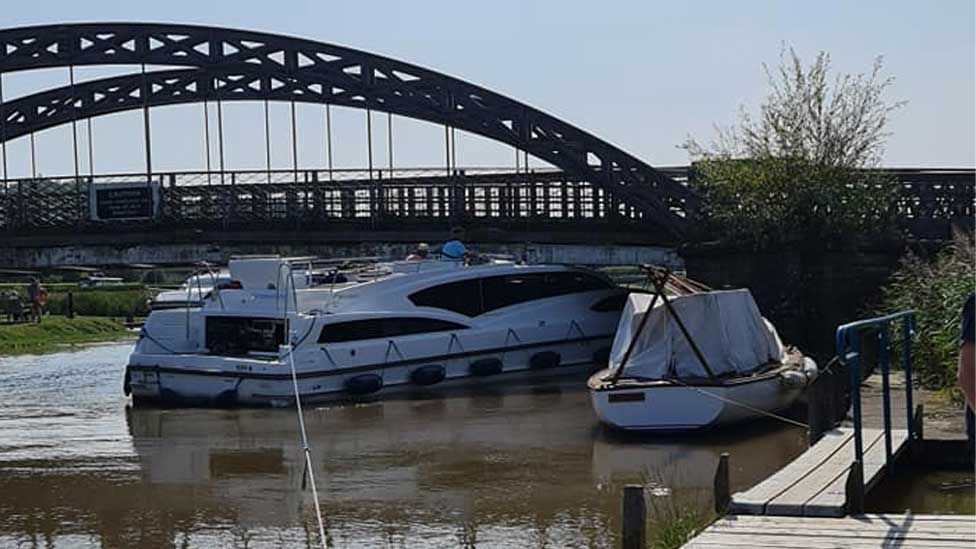 Cruiser wedged under bridge at St Olaves