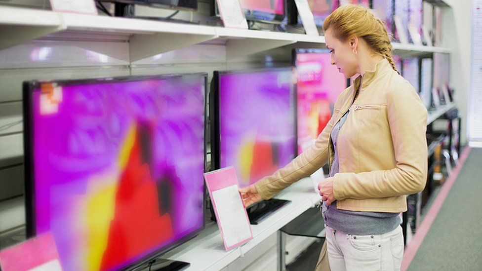 Woman buying television