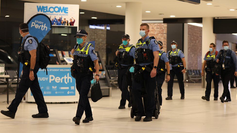 WA Police officers arrive ahead of international flight arrivals at the Perth International Airport Terminal on March 03, 2022 in Perth, Australia.