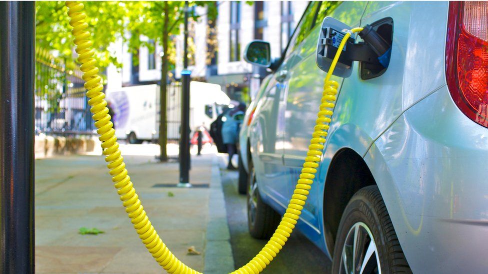 Electric car charging on the street