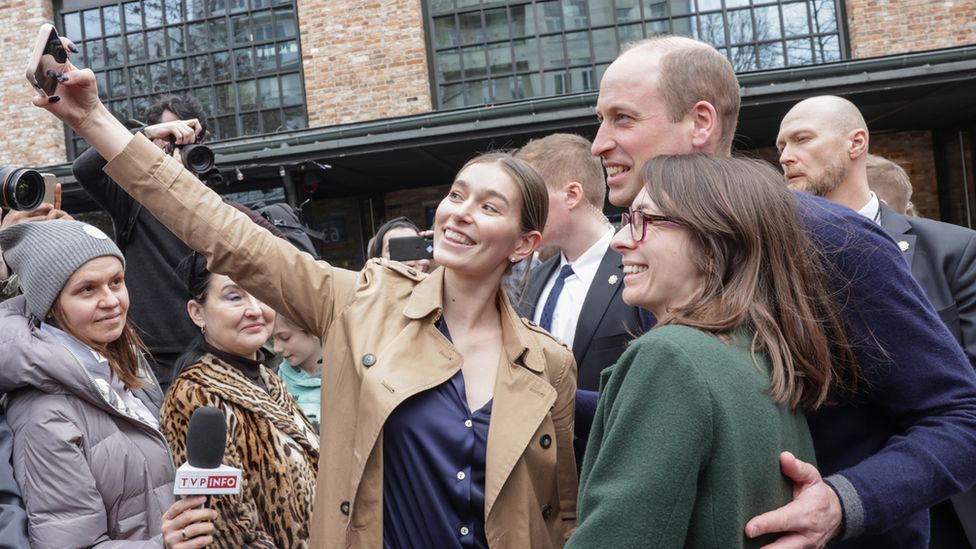 People taking selfies with Prince William