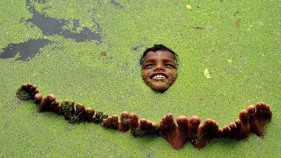 A boy plays with friends in Sundarban, India.