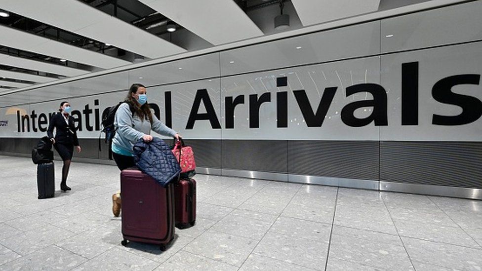 A woman arriving at a London airport