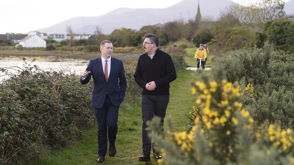 Infrastructure Minister Chris Hazzard and Jonathan Hobbs from NI Greenways walk along the old railway track near Dundrum, as the Minister launches his plan to develop 1000kms of greenways paths across the north, 9 November 2016