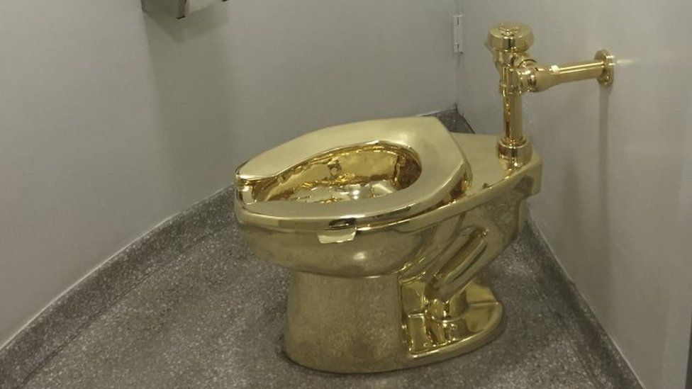 A fully functioning solid gold toilet made by Italian artist Maurizio Cattelan