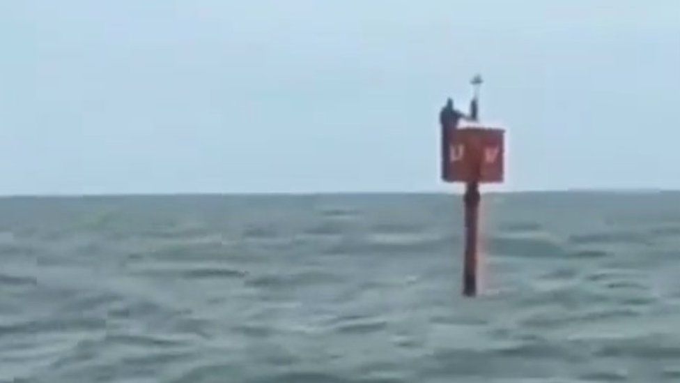 Fisherman survives by clinging to ocean buoy for two days - BBC