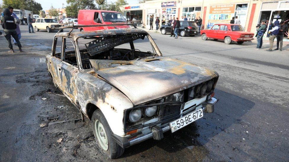 A burnt car, which was hit by shelling during a military conflict over the breakaway region of Nagorno-Karabakh, in the town of Barda, 28 October 2020